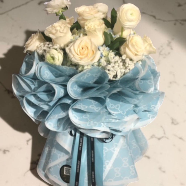 Ivory Rose Standing Bouquet in Blue Wrap by LaDonna Flowers