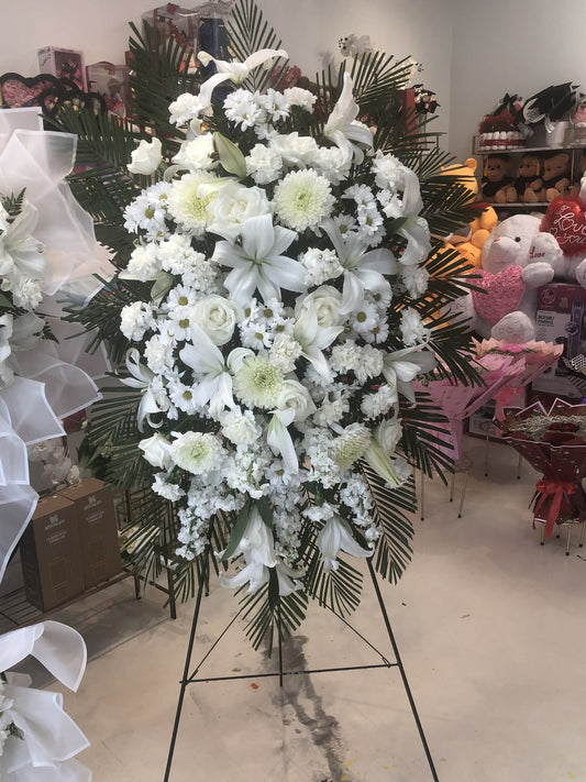 White Lily & Rose Sympathy Standing Spray by LaDonna Flowers